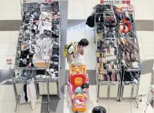  ?? ?? A shopper looks at goods in an Aeon mall in Chiba, Japan.