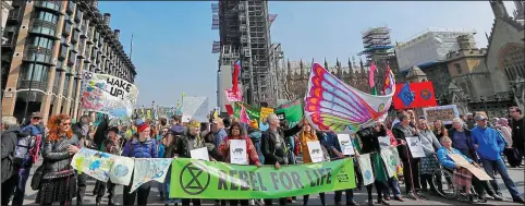  ??  ?? Disruptive: Members of the protest group Extinction Rebellion blocking London’s roads this week