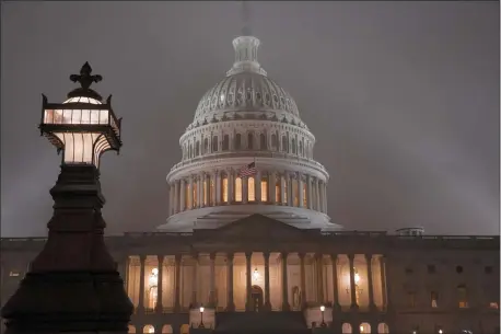  ?? J. SCOTT APPLEWHITE- ASSOCIATED PRESS ?? The U.S. Capitol in Washington is shrouded in mist.