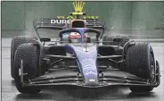  ?? (AP/The Canadian Press/Jacques Boissinot) ?? Williams driver Nicholas Latifi races during Saturday’s qualifying for today’s Formula One Canadian Grand Prix in Montreal. Latifi acknowledg­ed Saturday that his seat with Williams is not secure as driver changes are looming.