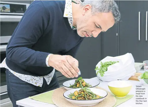  ?? KELSEY WILSON TORONTO STAR ?? Yotam Ottolenghi prepares a meal from his new cookbook in the Star test kitchen.