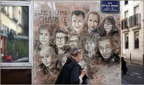  ??  ?? Une fresque en hommage aux victimes de l’attentat du 7 janvier 2015, à Paris.