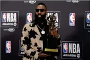  ?? ASSOCIATED PRESS ?? NBA PLAYER JAMES HARDEN, of the Houston Rockets, poses in the press room with the most valuable player award at the NBA Awards on Monday at the Barker Hangar in Santa Monica, Calif.