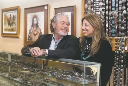  ?? MORGAN TIMMS/Taos News ?? Bill and Joy Slay, owners of Jackie’s Trading Post, stand for a portrait Saturday (Dec. 12) at their shop on Taos Plaza.