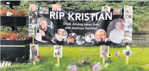  ??  ?? Paula Johnson with her son Kristian and the memorial banner which had to be taken down last year