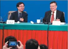  ?? ZHU XINGXIN / CHINA DAILY ?? Pan Jianwei (left), a quantum informatio­n specialist from the University of Science and Technology of China and a national political adviser, attends a news conference on Sunday in Beijing with other members of the 13th CPPCC National Committee.