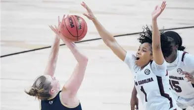  ?? ERIC GAY/AP ?? Georgia Tech guard Lotta-Maj Lahtinen, left, is pressured by South Carolina guard Zia Cooke (1) on Sunday in San Antonio.