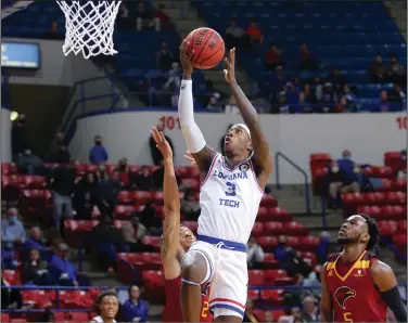  ?? Darrell James/Louisiana Tech Sports Informatio­n ?? To the basket: Louisiana Tech’s Amorie Archibald goes up for a shot during a game against Louisiana-Monroe earlier this season in Ruston, La. The Bulldogs will host Texas-San Antonio in a Conference USA series starting today at 6:30 p.m. Saturday’s game will begin at 6 p.m.