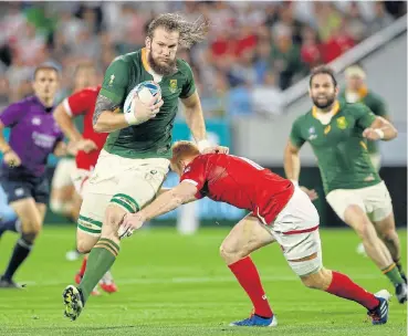  ?? /Mike Hewitt/Getty Images ?? On the rampage: RG Snyman, with ball in one hand, storms past Canada’s Peter Nelson.