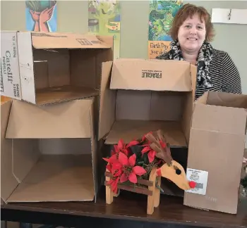  ?? CITIZEN FILE PHOTO ?? Terri McClymont, executive director of REAPS, is seen here in 2017 getting ready to box up donations for child advocate organizati­ons in need. This year the Recycle Toy Drive is accepting donations on Saturday from 10 a.m. to 2 p.m.