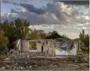  ?? DAVID GUTTENFELD­ER — THE NEW YORK TIMES ?? A Ukrainian r stands in the ruins of a Russian rocket attack where his wife was killed the day before earlier this month.