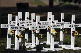  ?? JAE C. HONG — THE ASSOCIATED PRESS ?? Crosses with the names of Tuesday’s shooting victims are placed outside Robb Elementary School in Uvalde, Texas, on Thursday.