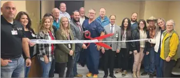  ?? Submitted Photo ?? Eastern Oklahoma Medical Center Chief Operating Officer Logan Hayes cuts the ribbon for the Oklahoma Heart Hospital Poteau location.