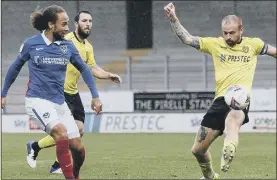  ??  ?? TOUCH OF CLASS Marcus Harness dinks home Pompey’s fourth and his third