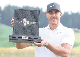  ??  ?? World No.1 Brooks Koepka poses with the 2018 CJ Cup in South Korea.