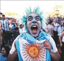  ?? REUTERS ?? An Argentina fan in Buenos Aires can’t contain his joy as he watches his team beat Mexico at the World Cup on Saturday.