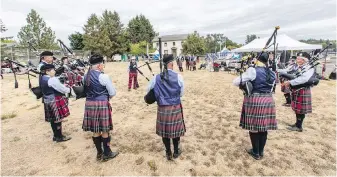  ?? DARREN STONE, TIMES COLONIST ?? The Greater Victoria Police Pipe Band plays during the 158th Victoria Highland Games & Celtic Festival at Craigflowe­r Manor on Saturday. The Games were scaled down and held at a smaller venue due to the COVID-19 pandemic.