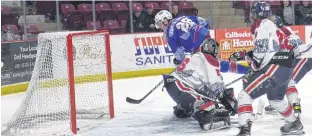  ?? JASON SIMMONDS/THE GUARDIAN ?? Forward and team captain Josh MacDonald scores the winning goal in the first minute of overtime to lift the Summerside D. Alex MacDonald Ford Western Capitals to a 5-4 victory over the Valley Wildcats Saturday night at Eastlink Arena.