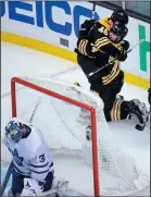  ?? AP PHOTO/CHARLES KRUPA ?? Boston Bruins left wing Jake DeBrusk is embraced by David Krejci (46) after his goal against Toronto Maple Leafs goaltender Frederik Andersen during Game 7 of an NHL playoff series in Boston, Wednesday.