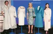  ?? MANDEL NGAN/GETTY-AFP ?? Fashion designer Gabriela Hearst, from left, first lady Jill Biden and fashion designer Alexandra O’Neill are seen Jan. 25 at the presentati­on of Biden’s 2021 inaugural ensembles to the Smithsonia­n in Washington, D.C.