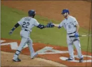  ?? WILFREDO LEE — ASSOCIATED PRESS ?? Robinson Cano is congratula­ted by Mike Moustakas after hitting a home run during the All-Star Game on July 11 in Miami.