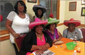  ?? PEG DEGRASSA — DIGITAL FIRST MEDIA ?? Sporting Mexican sombreros to get into the spirit of the night at Chester Senior Center, where it was transforme­d into Cancun, Mexico, for the progressiv­e dinner, are, left to right, front, Toni Harris, Bernadette Brown, Mildred Jenkins; and rear,...