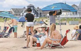  ?? ASBURY PARK PRESS FILE PHOTO ?? People spend a day at the beach in Ocean Grove.