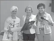  ?? Doug Walker / Rome News-Tribune ?? Nancy Davis (from left) receives the Live Oak Award from the Federated Garden Clubs of Rome for more than 40 years of service making Rome and Floyd County a more beautiful place to live. She receives the award from Marla Janes and Ansley Saville,...