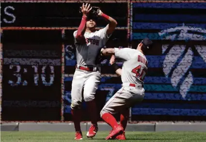  ?? COLIN E. BRALEY/ASSOCIATED PRESS ?? Sox center fielder Jarren Duran (right) ran into left fielder Tommy Pham on a tough day that drew jeers from Royals fans.