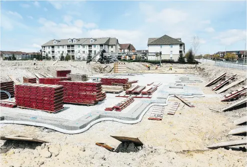  ?? MARK SOMMERFELD / BLOOMBERG FILES ?? Building materials sit at a constructi­on site in Whitby in the Greater Toronto Area, where the average detached home sold for $1,015,333 over the first two weeks of July, a 6.6 per cent increase from a year earlier.