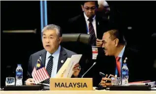  ??  ?? Ahmad Zahid and Home Ministry deputy secretary-general Datuk Seri Mustafa Ibrahim at the Asean Ministeria­l Meeting on Transnatio­nal Crime in Manila, the Philippine­s, yesterday.