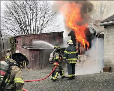  ?? COURTESY OF G. JEFFREY BEALER ?? Firefighte­rs work to contain the damage.