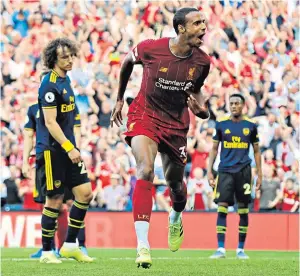  ??  ?? First blood: Joel Matip celebrates putting Liverpool ahead in their win over Arsenal