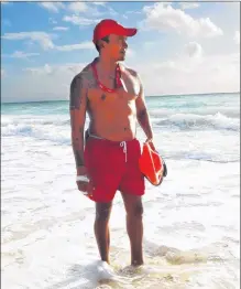  ?? STEVE MACNAULL PHOTO ?? Lifeguard William keeps watch on Playa Mujeres in front of Riu Dunamar Resort.