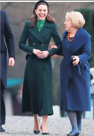  ?? AFP/GETTY ?? Clockwise from top: William and Kate walk with Michael D Higgins and his wife Sabina in Phoenix Park; Kate drinks a Guinness; the couple on their way to the Guinness Storehouse; talking with Leo Varadkar and partner Matthew Barrett, the message on the wreath laid at the Garden of Remembranc­e and ringing the Peace Bell