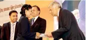  ??  ?? Prime Minister Ranil Wickremesi­nghe presenting an award to a winner at the Duke of Edinburgh internatio­nal awards 2016 organized by the National Youth Services Council yesterday. State Minister of National Policies and Economic Affairs Niroshan Perera,...