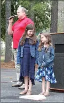  ?? The Sentinel-Record/Rebekah Hedges ?? LITTLE LEGACIES: Lexi Stevens, 11, and Naddy Stevens, 4, Babe Ruth’s great-granddaugh­ters, stand at the historical memorial plate in Whittingto­n Park while historian Bill Jenkinson recounts the story of Ruth’s 500foot home run a century ago on Saturday.