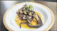 ?? CONTRIBUTE­D BY MIA YAKEL / STYLING BY TARA MAYFIELD ?? The octopus with mango chili sauce at the Consulate might not be perfect, but it’s still a lot of fun.