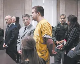  ?? ANTONIO PEREZ/CHICAGO TRIBUNE ?? Jason Van Dyke, center, and his attorney Daniel Herbert attend the former Chicago police officer’s sentencing hearing at the Leighton Criminal Court Building on Jan. 18.