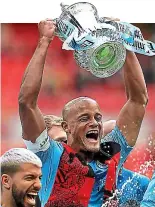  ??  ?? Winners: Manchester City’s Vincent Kompany with the FA Cup last year