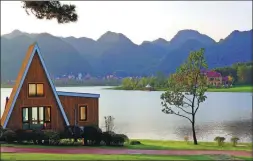  ?? PHOTOS PROVIDED TO CHINA DAILY ?? From top: Trees bloom in Guiyang’s Gui’an new district’s cherry orchard. Farmers play reed instrument­s to beseech the heavens for bountiful harvests. Villagers farm in Guiyang’s Gaofeng town. Yunman Lake ecological park in Gui’an new district.