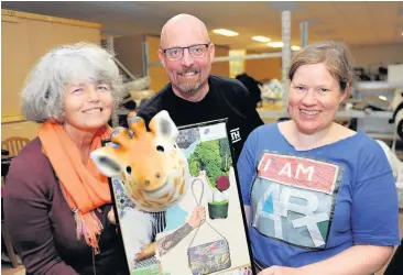  ?? ?? Creative work Eve Ferguson, left, of Community Networks; Reuben Millward, of Education and Informatio­n RAMH and artist Julie Boswell thoroughly enjoyed the event Upcycling Purple patch