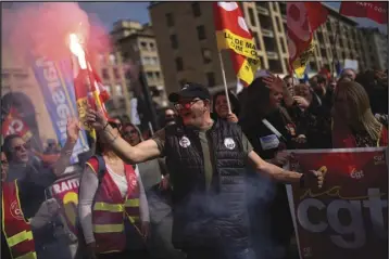  ?? ASSOCIATED PRESS ?? A protester holds a flare during a demonstrat­ion on Tuesday in Marseille, southern France.