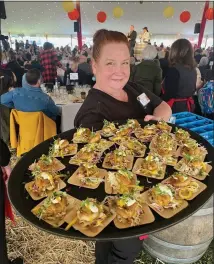  ?? CONTRIBUTE­D ?? Operations Director, Jeremie Foley, serving a tray of Crab Cakes.