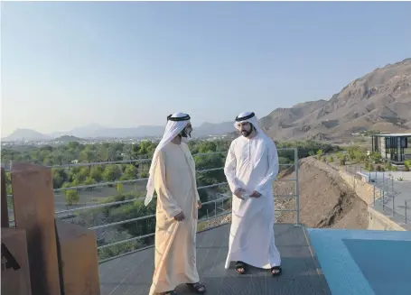  ?? WAM ?? Sheikh Mohammed bin Rashid, Vice President and Ruler of Dubai, and Sheikh Hamdan bin Mohammed, Crown Prince of Dubai, at Hatta in the Hajar Mountains, which will be developed into a major tourist destinatio­n