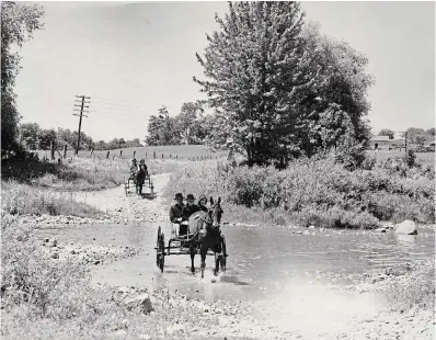  ?? HUNSBERGER FAMILY COLLECTION ?? The original 1954 photograph looking west along Three Bridges Road across the Conestogo River was taken by David L. Hunsberger. In the photo with the April 22 column, the telephone poles were removed.