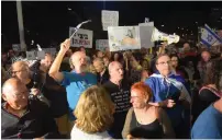  ?? (Avshalom Sassoni) ?? SOME 300 PEOPLE protest near Attorney-General Avichai Mandelblit’s home in Petah Tikva last night, calling on him to indict Prime Minister Benjamin Netanyahu on corruption charges.