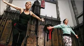  ?? THE COLUMBUS DISPATCH ?? Rachael Gardner Purdy (left) and Virginia Geddes participat­e in a yoga class with the Rev. Nicole Havelka at the First Congregati­onal United Church of Christ in downtown Columbus.