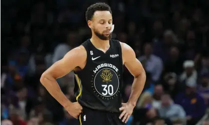  ?? Photograph: Matt York/AP ?? Stephen Curry takes in a painful loss to the Phoenix Suns on Wednesday night.