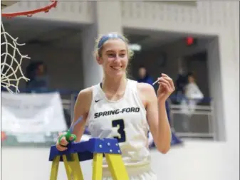  ?? AUSTIN HERTZOG — MEDIANEWS GROUP ?? Spring-Ford’s Lucy Olsen cuts down the net after the Rams’ second straight PAC title this past season.